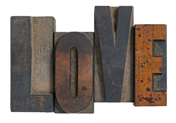 Isolated love spelled out in wooden vintage letterpress type printing blocks