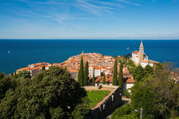 The old medieval centre of Piran on the coast of Slovenia. The large church is  St George's Parish...