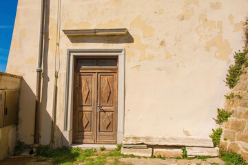A side door in the historic St George's Parish Church in the medieval centre of Piran on the coast...
