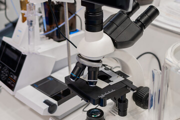 Close up view of laboratory equipment, optical microscope. Science, biology, optical and education concept