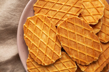 Homemade Waffle Crisps on a Plate, top view. Flat lay, overhead, from above. Close-up.