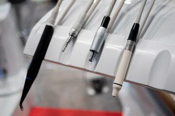 Different tools and dentistry instruments in dental office, surgery. Stomatology, healthcare, medicine and equipment concept