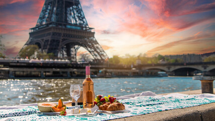 Picnic and wine near the Eiffel Tower. Selective focus.