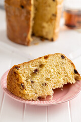 Panettone Christmas Cake. Italian sweet bread on white kitchen table.
