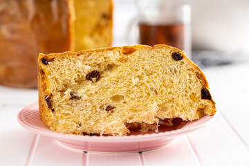 Panettone Christmas Cake. Italian sweet bread on white kitchen table.