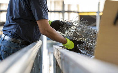 A separate collection employee distributes the various waste in special recycling bins. Worker at...