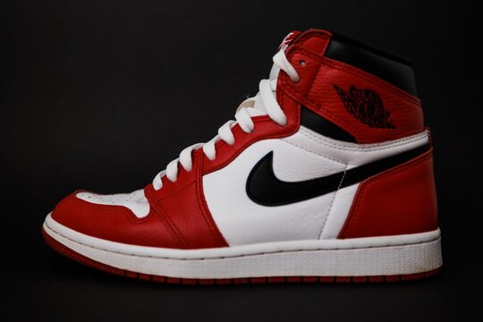 Red Nike Air Jordan I shoe with black background