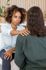 African American female psychologist conducts an appointment with a patient in the office. mental health and moral support. woman is a patient with mental difficulties and a mental disorder
