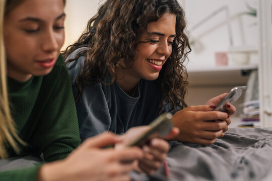 close up of teenager female using smart phone