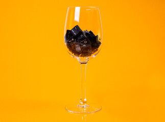keyboard button in glass in jar in bucket on orange background
