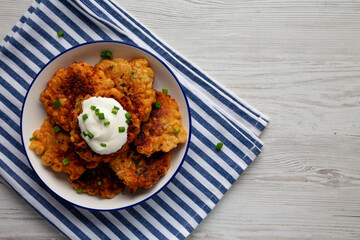 Homemade Fried Cheddar Corn Fritters on a Plate, top view. Flat lay, overhead, from above. Copy space.