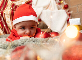 baby playing with christmas lights 