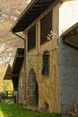 Fototapeta na wymiar Irone, medieval Alpine village in Trentino, Italy, a touristic destination seen on a sunny autumn day