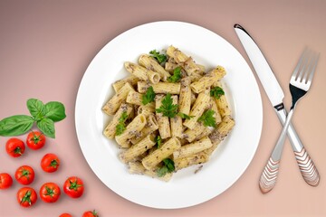 Italian pasta dish with cheese, tomato and fresh vegetables.