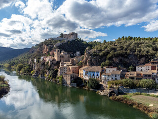Fototapeta na wymiar Aerial view of Miravet Castle in Catalonia, Tarragona province in Spain. with a view of the Ebro river next to the medieval town of Miravet
