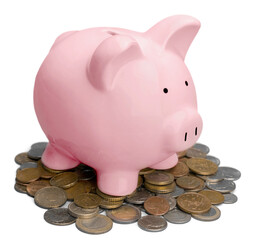 Piggy bank and coins on wooden table