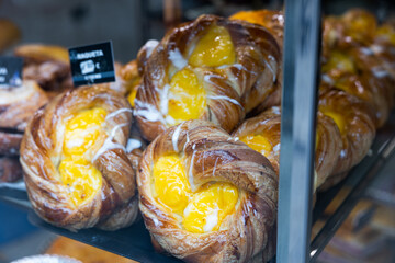 Popular pastries of Spanish cuisine Raqueta, laid out on the counter for sale in a pastry shop