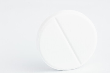 The photo shows one white pill macro