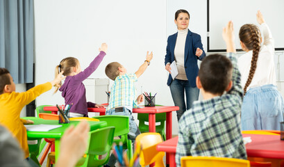 Teacher conducts lesson in elementary school. High quality photo