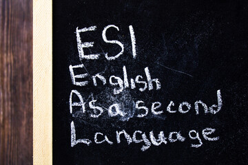 Esl - English As A Second Language text concept on chalk board.