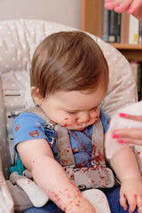 Fototapeta premium first birthday celebration and first time eating cake for this little toddler boy