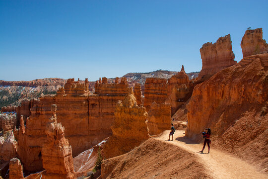 Bryce Canyon National Park, Utah, United States. Hoodoos and rock formations. People walking on trail in Bryce canyon 