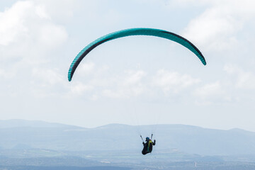 A paraglider flight in a blue sky with clouds.
Paragliding, paraglider, paraglider pilot, flying,...