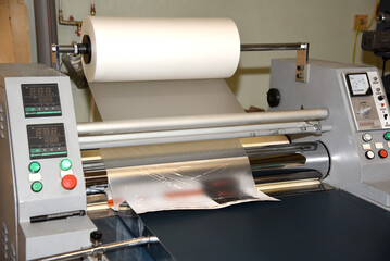 Electric industrial laminator for applying film to paper in the production shop