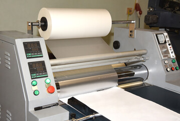 Electric industrial laminator for applying film to paper in the production shop