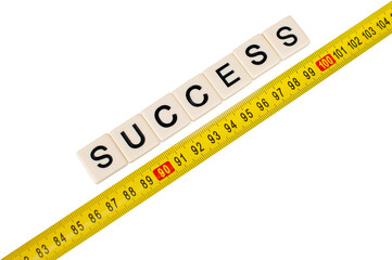 Yellow measuring tape with word success isolated on white background