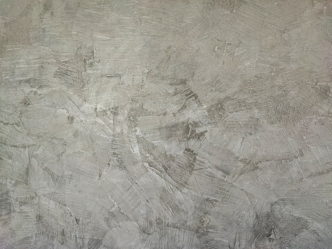 Loft style cement wall. Loft style uneven color plaster floor. and has rough marks.