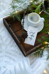 Cup of coffee and card with text 