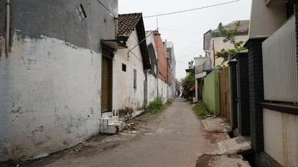 Fototapeta na wymiar Photo of a narrow street or alley in a village in Indonesia.