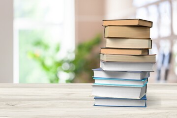A simple composition of many books, stack or pile of books on wooden table concept