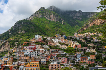 Fototapeta na wymiar The picturesque small Italian town of Positano, descending from the terraces from the mountains to the Mediterranean Sea. This is one of the most famous places on the Amalfi Coast.