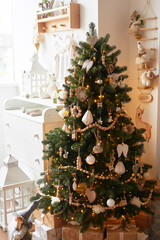 Winter holidays and vacations. Christmas and New Year decor background. Christmas tree and toys. Santa's Residence. Holiday apartment interior
