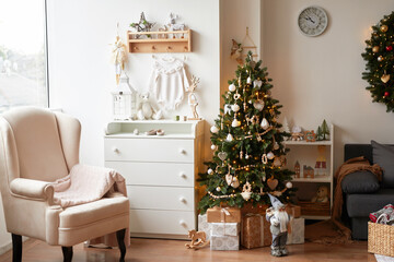 Winter holidays and vacations. Christmas and New Year decor background. Christmas tree and toys. Nursery Christmas decoration. Children's room interior