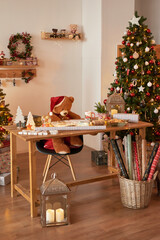 Winter holidays and vacations. Christmas and New Year decor background. Christmas tree and toys. Santa's Residence. Holiday apartment interior