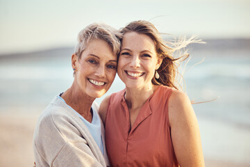 Beach, hug and elderly mother and daughter relax, bond and enjoy quality time freedom, peace or travel vacation. Mamas love, nature wind and happy family portrait of women on Toronto Canada holiday - obrazy, fototapety, plakaty