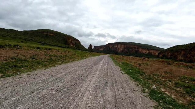 FPV riding bike in volcanic area of Longonot in Hell's Gate National Park. Day