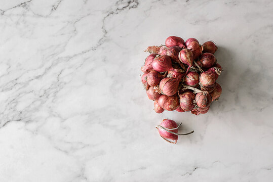 small shallots on a light background