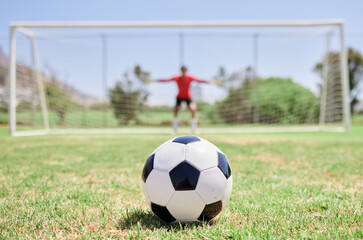 Soccer ball, football field and goalkeeper ready for defense to stop goals for penalty kick game on...