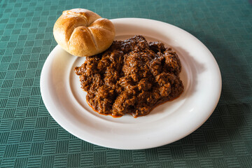 Viennes Goulash or Wiener Saftgulasch with a Kaiser Roll made with Beef and Paprika