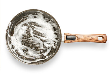 Frying pan with detergent foam. Washing dishes after cooking