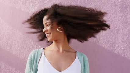 Funky woman shaking natural curly hair on pink wall background, summer sunshine and mockup. Retro, carefree and cool empowerment girl with afro hairstyle for hair care and self love mock up outdoor