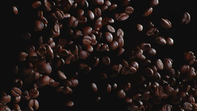 Coffee beans tossed in air slow motion