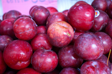 red plums on the table