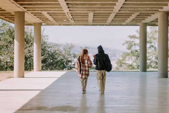 High School Girls Walking In The School's Yard