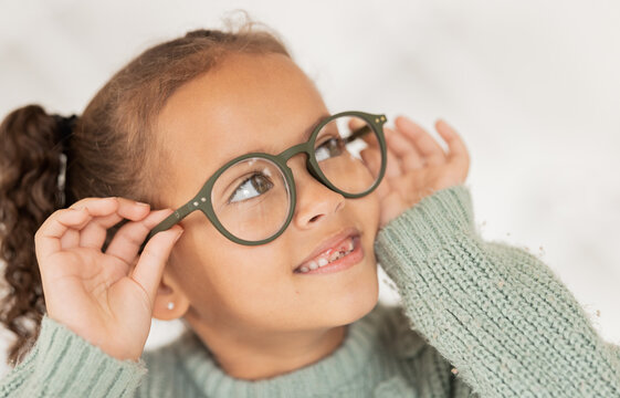 Child, glasses and eye care for vision, focus and concentration while wearing quality lens frame optician choice. Face of girl looking happy about optics fashion mockup for eyesight correction
