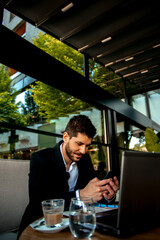 Working on his phone